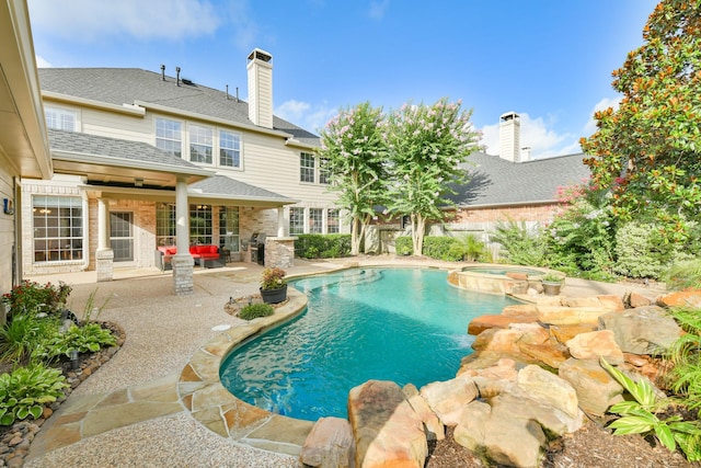 16050 Lockdale Ln, Cypress, TX 77429 - view of pool with a patio area and a pool with connected hot tub