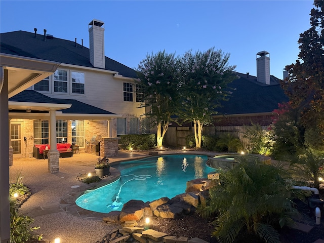 16050 Lockdale Ln, Cypress, TX 77429 - view of pool featuring a patio, a pool with connected hot tub, and an outdoor living space