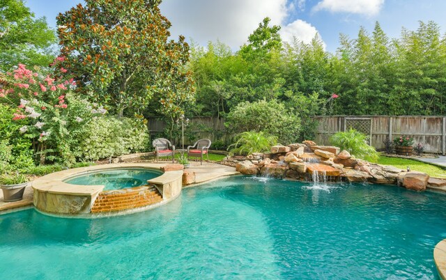 16050 Lockdale Ln, Cypress, TX 77429 - view of pool with a fenced backyard and a pool with connected hot tub