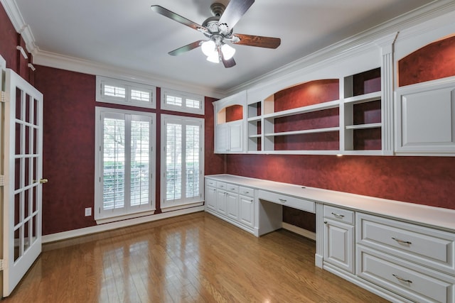 16050 Lockdale Ln, Cypress, TX 77429 - unfurnished office featuring built in study area, ornamental molding, light wood-style floors, and a ceiling fan