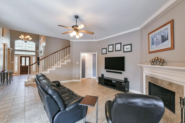 16050 Lockdale Ln, Cypress, TX 77429 - living area featuring light tile patterned floors, a chandelier, ceiling fan, a high end fireplace, and ornamental molding
