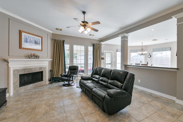16050 Lockdale Ln, Cypress, TX 77429 - living area featuring a ceiling fan, healthy amount of natural light, a chandelier, a fireplace, and ornamental molding