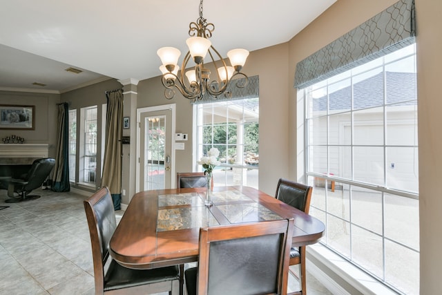 16050 Lockdale Ln, Cypress, TX 77429 - dining space with healthy amount of natural light, a chandelier, and a fireplace