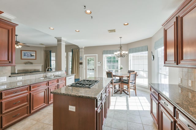 16050 Lockdale Ln, Cypress, TX 77429 - kitchen featuring tasteful backsplash, stainless steel gas stovetop, light tile patterned floors, dishwasher, and recessed lighting