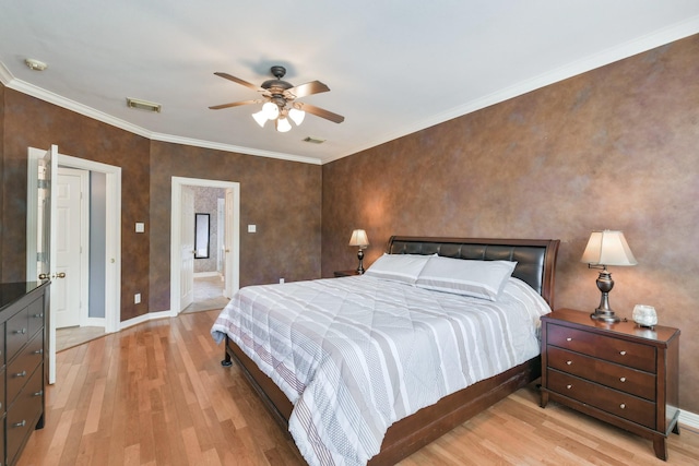 16050 Lockdale Ln, Cypress, TX 77429 - bedroom featuring light wood-type flooring, ornamental molding, and a ceiling fan