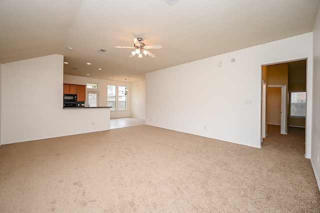 6846 Durango Creek Dr, Magnolia, TX 77354 - unfurnished living room featuring ceiling fan, light colored carpet, and recessed lighting