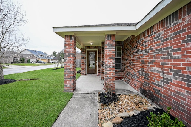 6846 Durango Creek Dr, Magnolia, TX 77354 - property entrance featuring a lawn, brick siding, and a porch