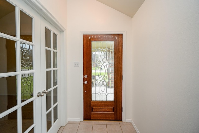 6846 Durango Creek Dr, Magnolia, TX 77354 - foyer with french doors, light tile patterned flooring, and vaulted ceiling