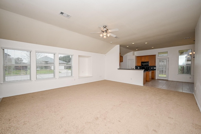 6846 Durango Creek Dr, Magnolia, TX 77354 - unfurnished living room featuring light colored carpet, a ceiling fan, vaulted ceiling, and recessed lighting