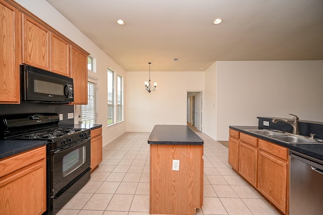 6846 Durango Creek Dr, Magnolia, TX 77354 - kitchen with black appliances, a center island, a chandelier, dark countertops, and recessed lighting