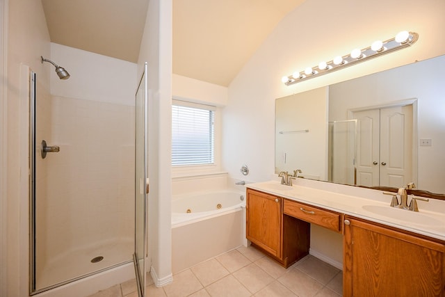 6846 Durango Creek Dr, Magnolia, TX 77354 - bathroom featuring a jetted tub, a stall shower, double vanity, vaulted ceiling, and tile patterned flooring