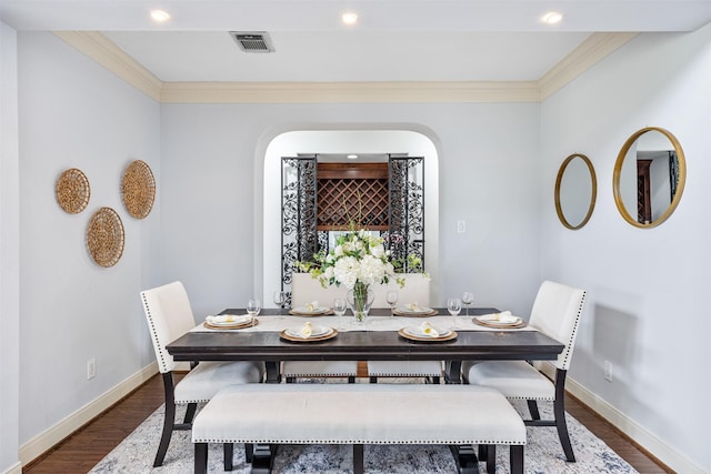 11710 Montmarte Blvd, Houston, TX 77082 - dining space featuring crown molding, wood finished floors, arched walkways, and recessed lighting