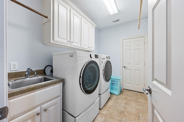 11710 Montmarte Blvd, Houston, TX 77082 - laundry area with washer and dryer and cabinet space