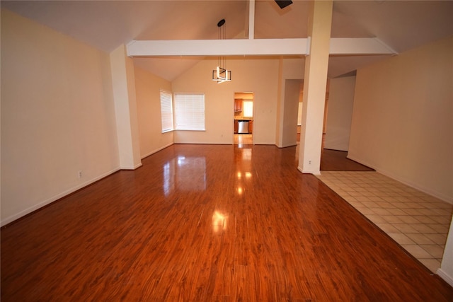 2926 Field Line Dr, Sugar Land, TX 77479 - spare room with wood finished floors and high vaulted ceiling