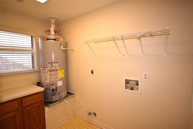 2926 Field Line Dr, Sugar Land, TX 77479 - laundry room with gas water heater, electric dryer hookup, cabinet space, gas dryer hookup, and hookup for a washing machine