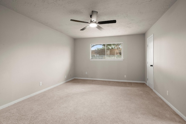 11258 Rousseau Dr, Houston, TX 77065 - unfurnished room featuring light carpet, a textured ceiling, and a ceiling fan