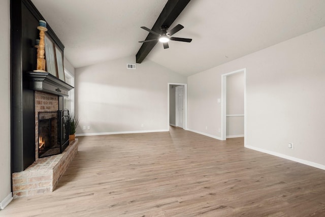11258 Rousseau Dr, Houston, TX 77065 - unfurnished living room with a ceiling fan, a fireplace, and light wood-style flooring
