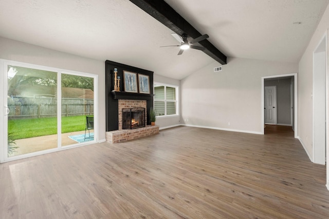 11258 Rousseau Dr, Houston, TX 77065 - unfurnished living room featuring wood finished floors, ceiling fan, and a brick fireplace