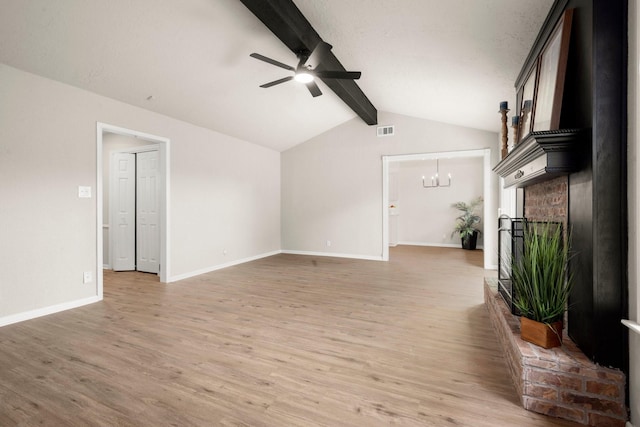11258 Rousseau Dr, Houston, TX 77065 - unfurnished living room with a ceiling fan, light wood finished floors, a chandelier, and a fireplace