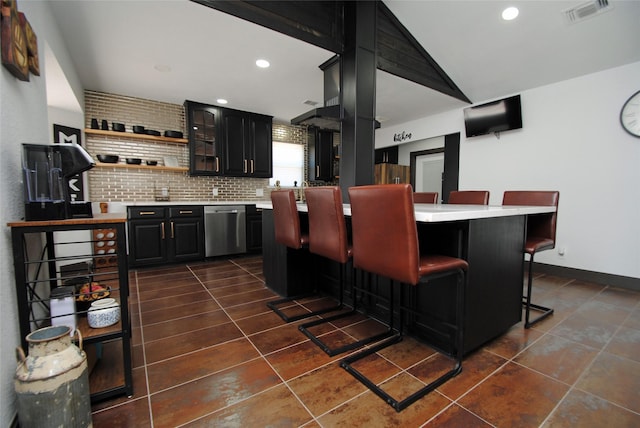 14306 Waterville Way, Houston, TX 77015 - bar area with dishwasher, dark tile patterned flooring, backsplash, recessed lighting, and vaulted ceiling