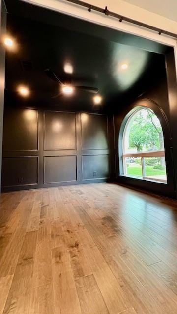 2823 Stetson Ln, Houston, TX 77043 - unfurnished room with light wood-style floors and a decorative wall