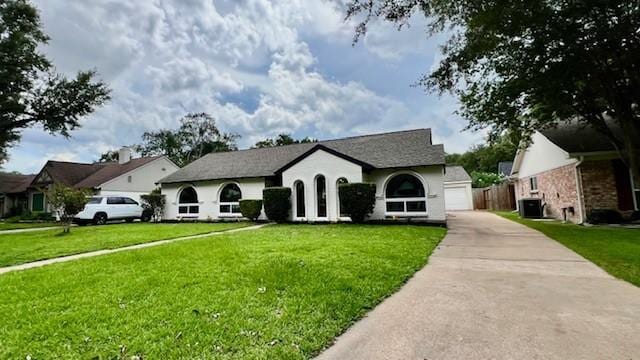 2823 Stetson Ln, Houston, TX 77043 - view of front of house with concrete driveway, a front yard, and a garage