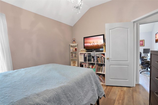 3816 Lake View Dr, Pearland, TX 77581 - bedroom featuring light wood-style floors, vaulted ceiling, a desk, and a chandelier