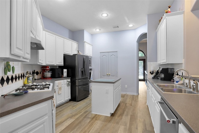 3816 Lake View Dr, Pearland, TX 77581 - kitchen featuring refrigerator with ice dispenser, arched walkways, dishwasher, white gas cooktop, and white cabinets