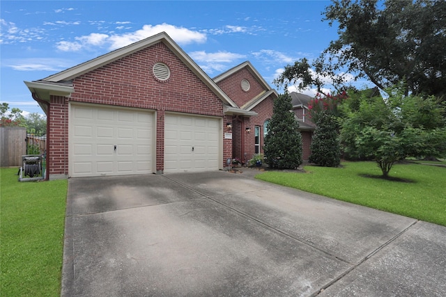 3816 Lake View Dr, Pearland, TX 77581 - view of front of home featuring brick siding, driveway, a front yard, and an attached garage
