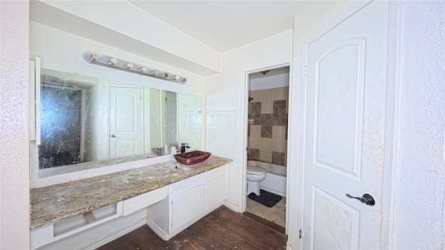 5625 Antoine Dr Unit 606, Houston, TX 77091 - full bath featuring vanity, wood finished floors, a shower, and a tub to relax in