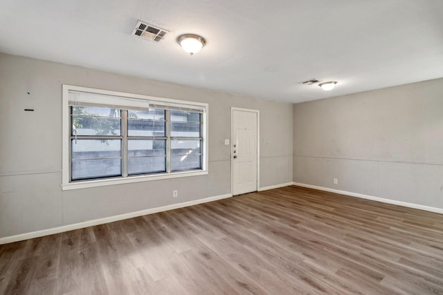 122 22nd Ave N, Texas City, TX 77590 - spare room featuring wood finished floors