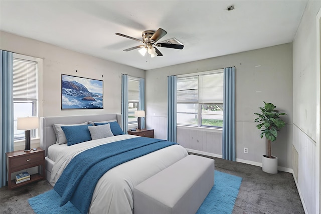122 22nd Ave N, Texas City, TX 77590 - carpeted bedroom featuring ceiling fan and wainscoting