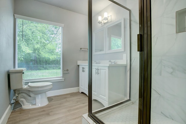 4523 Keystone St, Houston, TX 77021 - full bath featuring vanity, a marble finish shower, and wood finished floors
