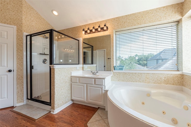 2013 Port Bridge Ln, League City, TX 77573 - bathroom featuring a whirlpool tub, a shower stall, vanity, vaulted ceiling, and wallpapered walls