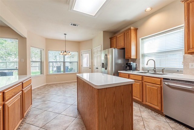 2013 Port Bridge Ln, League City, TX 77573 - kitchen with stainless steel appliances, light tile patterned flooring, light countertops, and recessed lighting