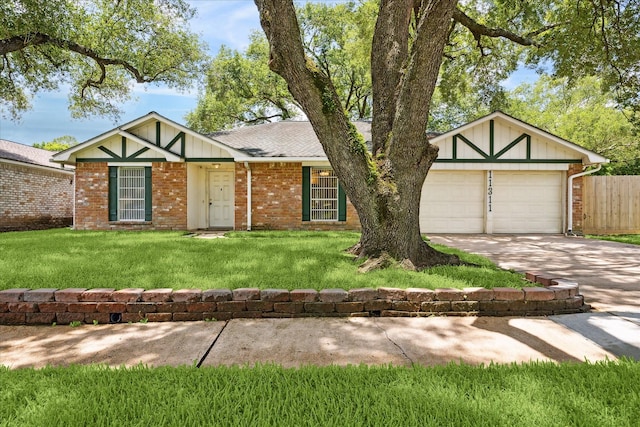 11311 Terrebone Dr, Cypress, TX 77429 - view of front of house with driveway, an attached garage, brick siding, and a shingled roof