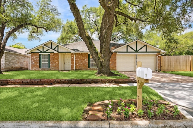 11311 Terrebone Dr, Cypress, TX 77429 - view of front facade with driveway, brick siding, roof with shingles, and a garage