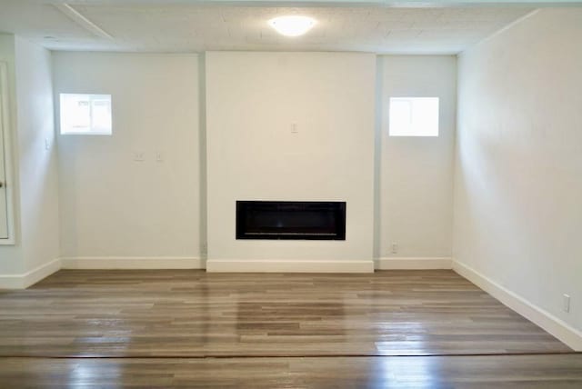 5010 Malmedy Rd, Houston, TX 77033 - below grade area featuring healthy amount of natural light, wood finished floors, and a fireplace