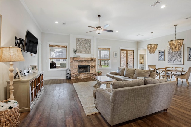 1929 Spanish Moss Dr, College Station, TX 77845 - living area featuring healthy amount of natural light, dark wood-style floors, a fireplace, a ceiling fan, and recessed lighting