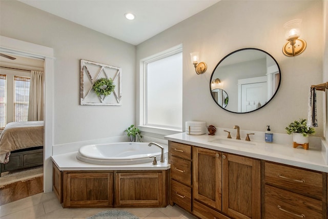 1929 Spanish Moss Dr, College Station, TX 77845 - bathroom featuring vanity, tile patterned flooring, a garden tub, and ensuite bath