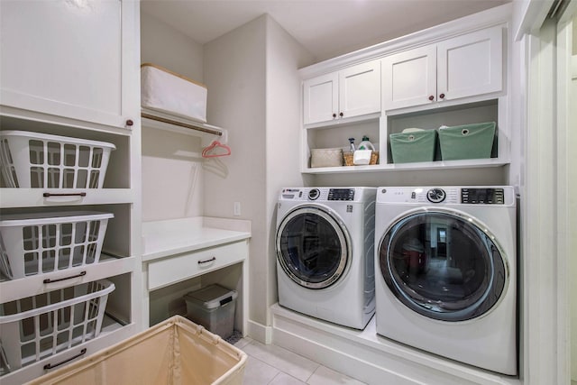 1929 Spanish Moss Dr, College Station, TX 77845 - laundry area with independent washer and dryer, cabinet space, and light tile patterned floors