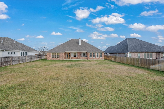 1929 Spanish Moss Dr, College Station, TX 77845 - rear view of property with brick siding and a fenced backyard