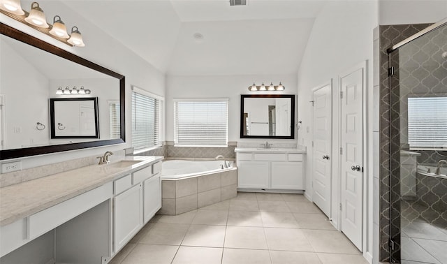 10609 Centre Green Way, Houston, TX 77043 - full bathroom with vaulted ceiling, two vanities, a bath, tile patterned flooring, and a tile shower