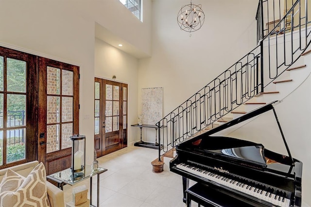 2514 Detering St, Houston, TX 77007 - foyer entrance featuring a towering ceiling, french doors, healthy amount of natural light, and stairway