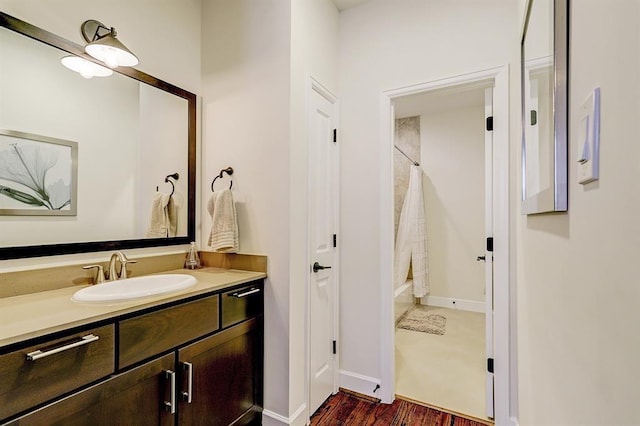 2514 Detering St, Houston, TX 77007 - full bathroom featuring vanity, wood finished floors, and shower / bathtub combination with curtain