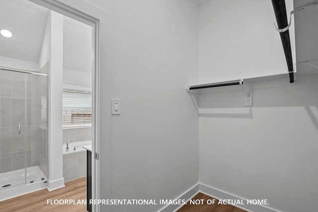 20626 Draper Rd, Tomball, TX 77377 - spacious closet featuring wood finished floors