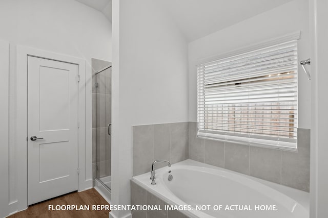20626 Draper Rd, Tomball, TX 77377 - bathroom featuring a garden tub, a shower stall, vaulted ceiling, and wood finished floors
