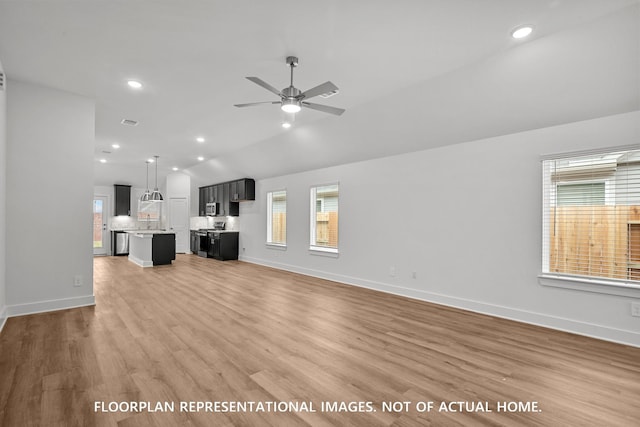 20626 Draper Rd, Tomball, TX 77377 - unfurnished living room with healthy amount of natural light, ceiling fan, lofted ceiling, light wood-style flooring, and recessed lighting