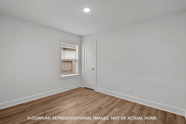 20626 Draper Rd, Tomball, TX 77377 - empty room with wood finished floors and baseboards