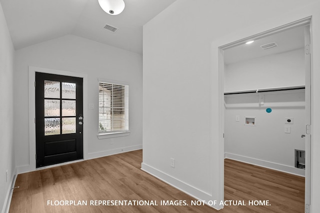 20626 Draper Rd, Tomball, TX 77377 - entryway featuring wood finished floors and vaulted ceiling